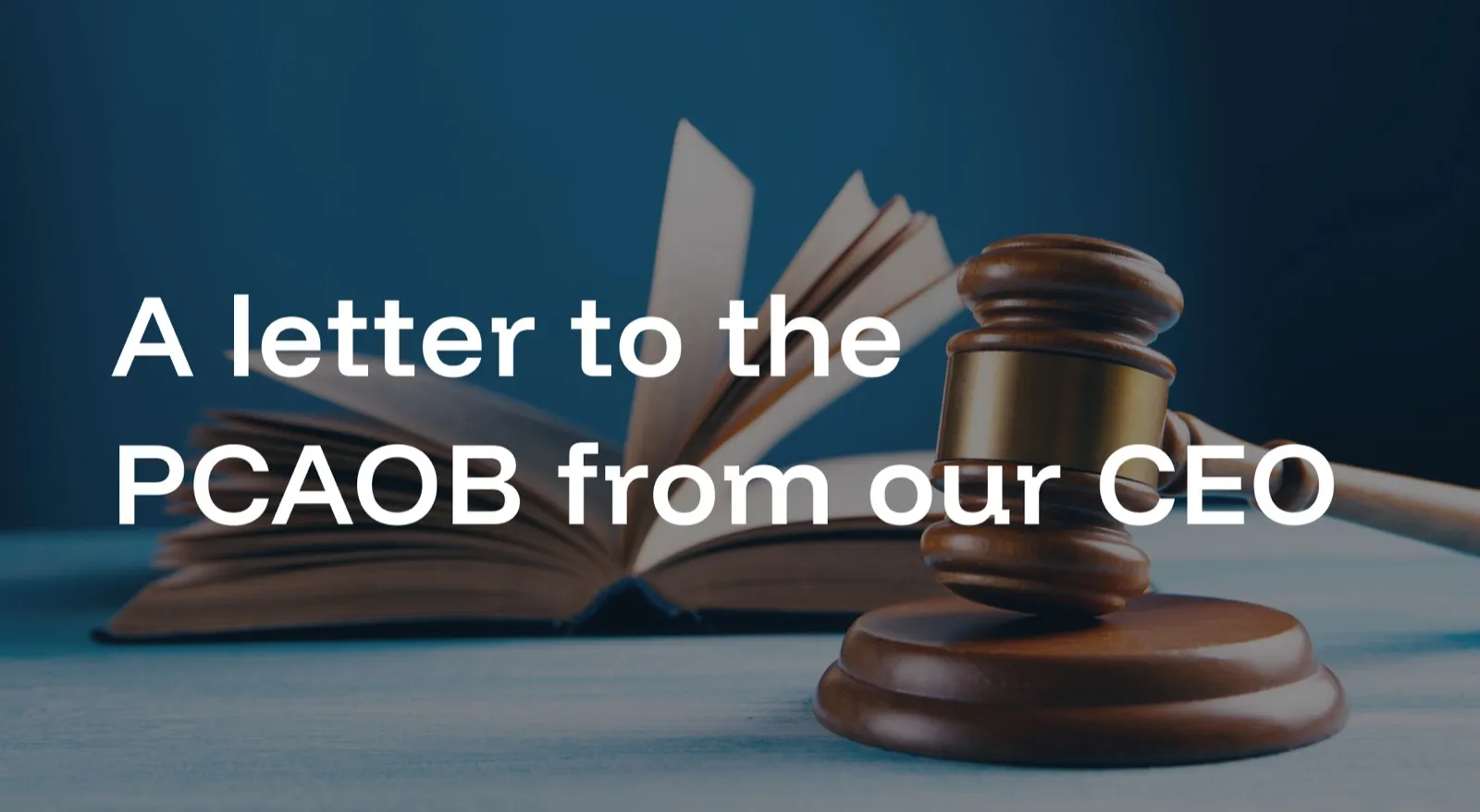 Title card reading "A letter to the PCAOB from our CEO" over a photograph of a wooden gavel resting beside an open book on a blue background.
